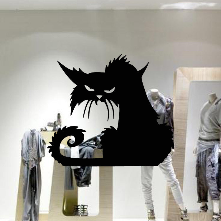 Prowling black cat wall decal applied to a large shop window