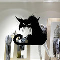 Prowling black cat wall decal applied to a large shop window