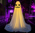 Hanging cloth ghost decoration with crossed X eyes and a jagged jack-o-lantern grin