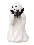 White resin ghost figurine holding a small black bat up to its face