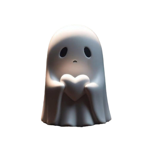White ghost figurine holding a matching white heart