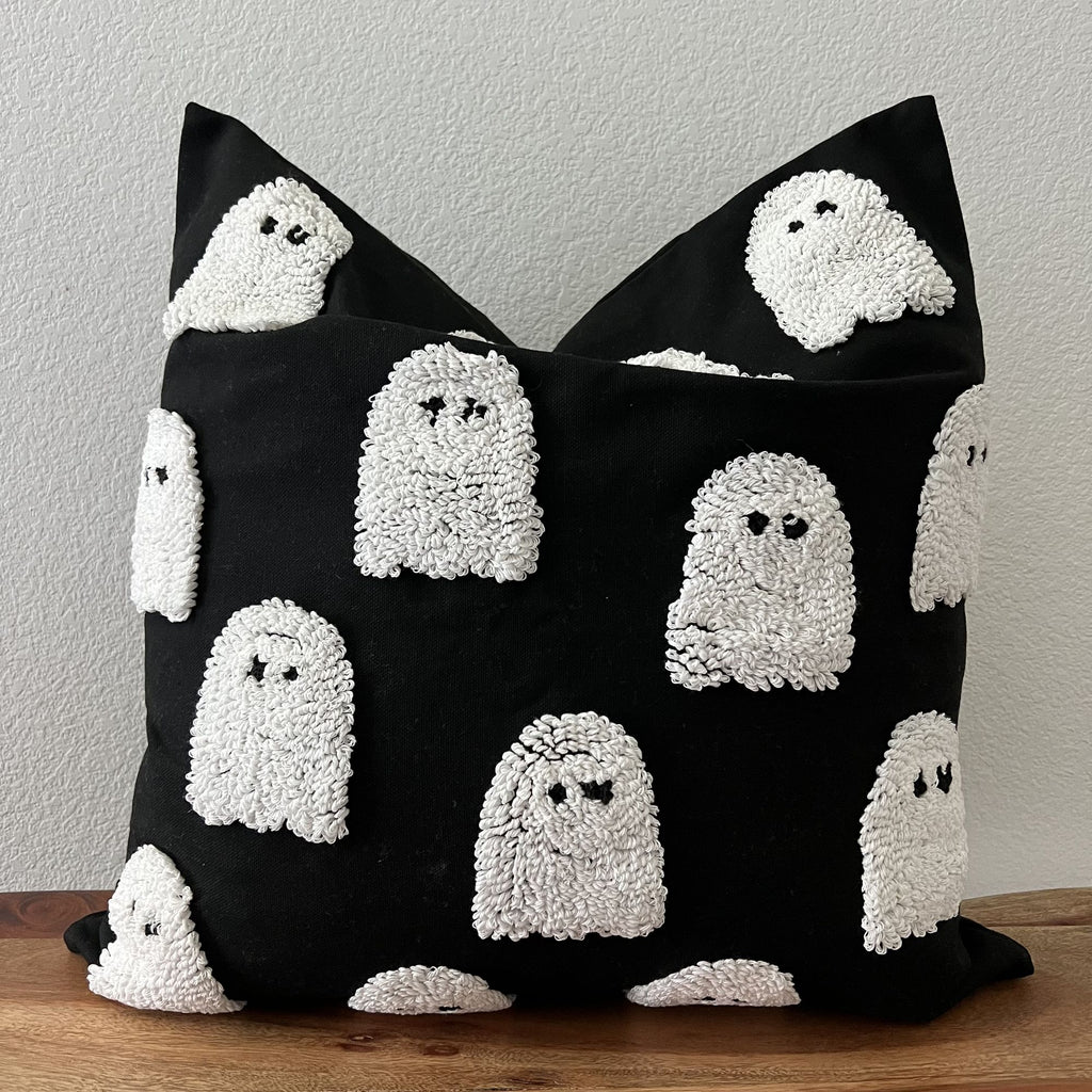 Black 20 inch pillow cover with cream tufted ghosts in raised punch-needle texture
