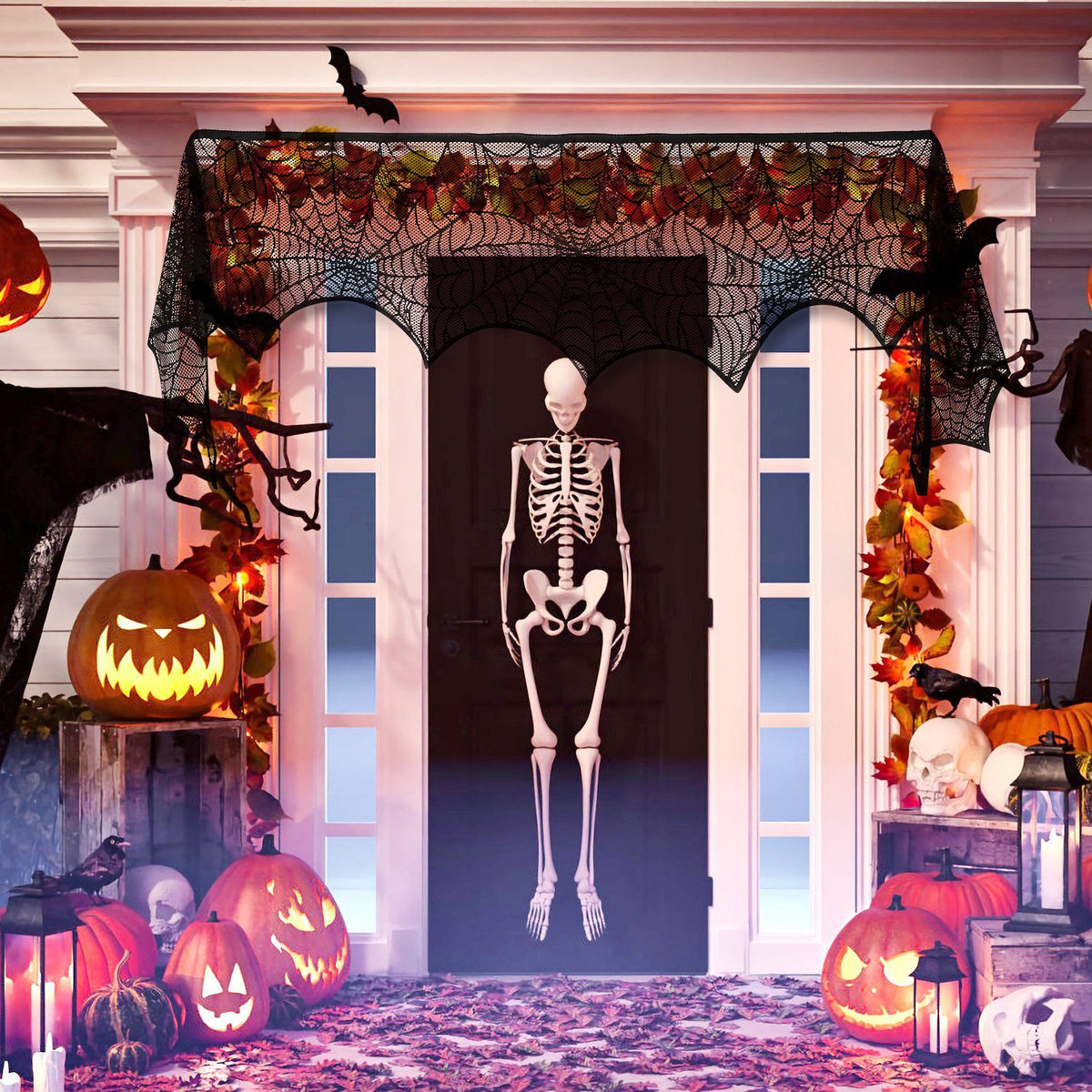 Spiderweb lace scarf hung over a front doorway with jack-o-lanterns and a skeleton